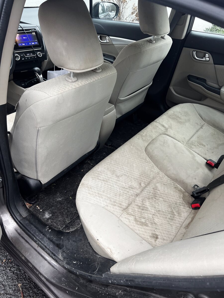 Honda Civic rear seats before interior detailing - stained fabric